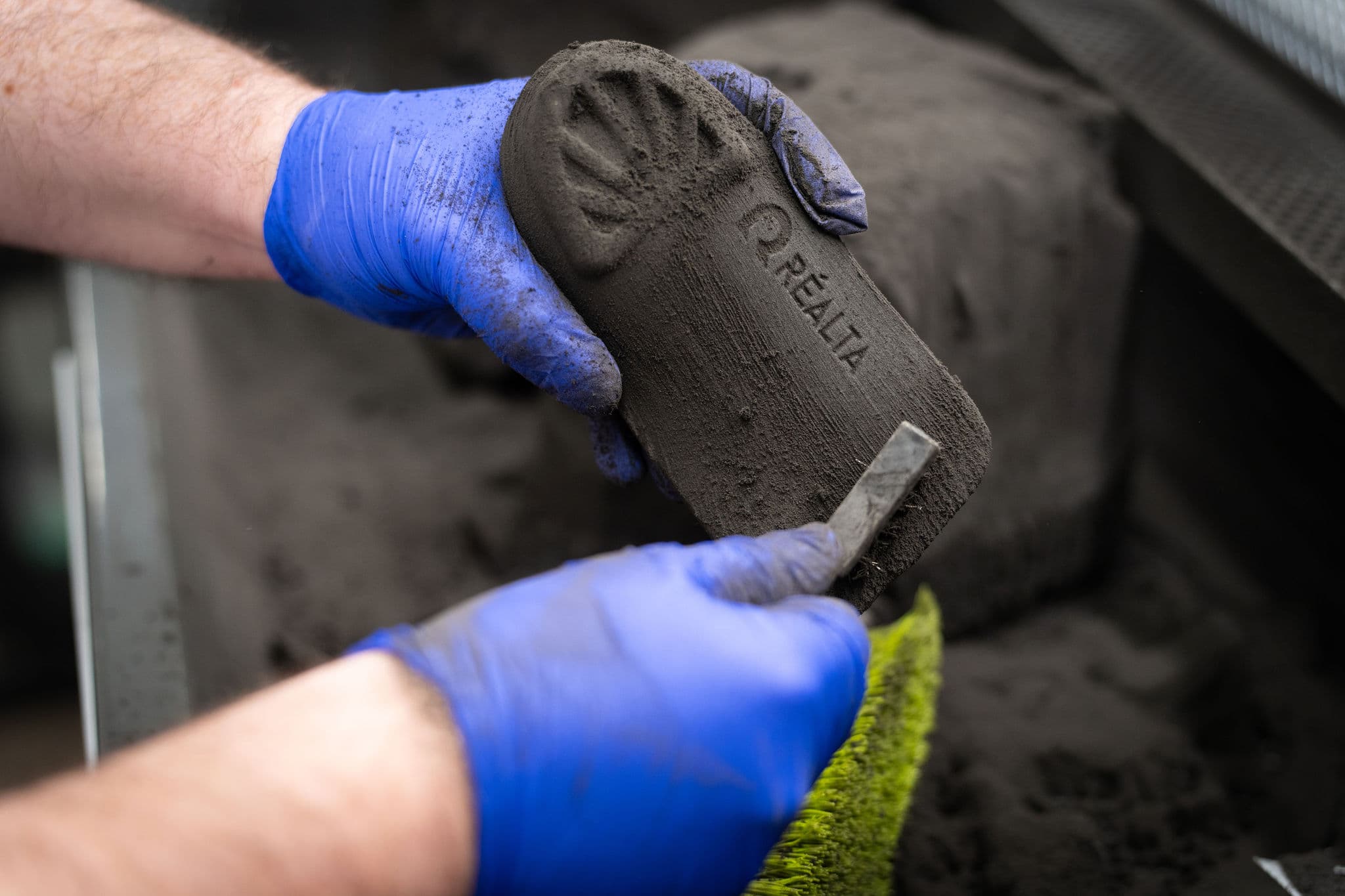 Brushing PA11 powder off a freshly printed orthotic shell