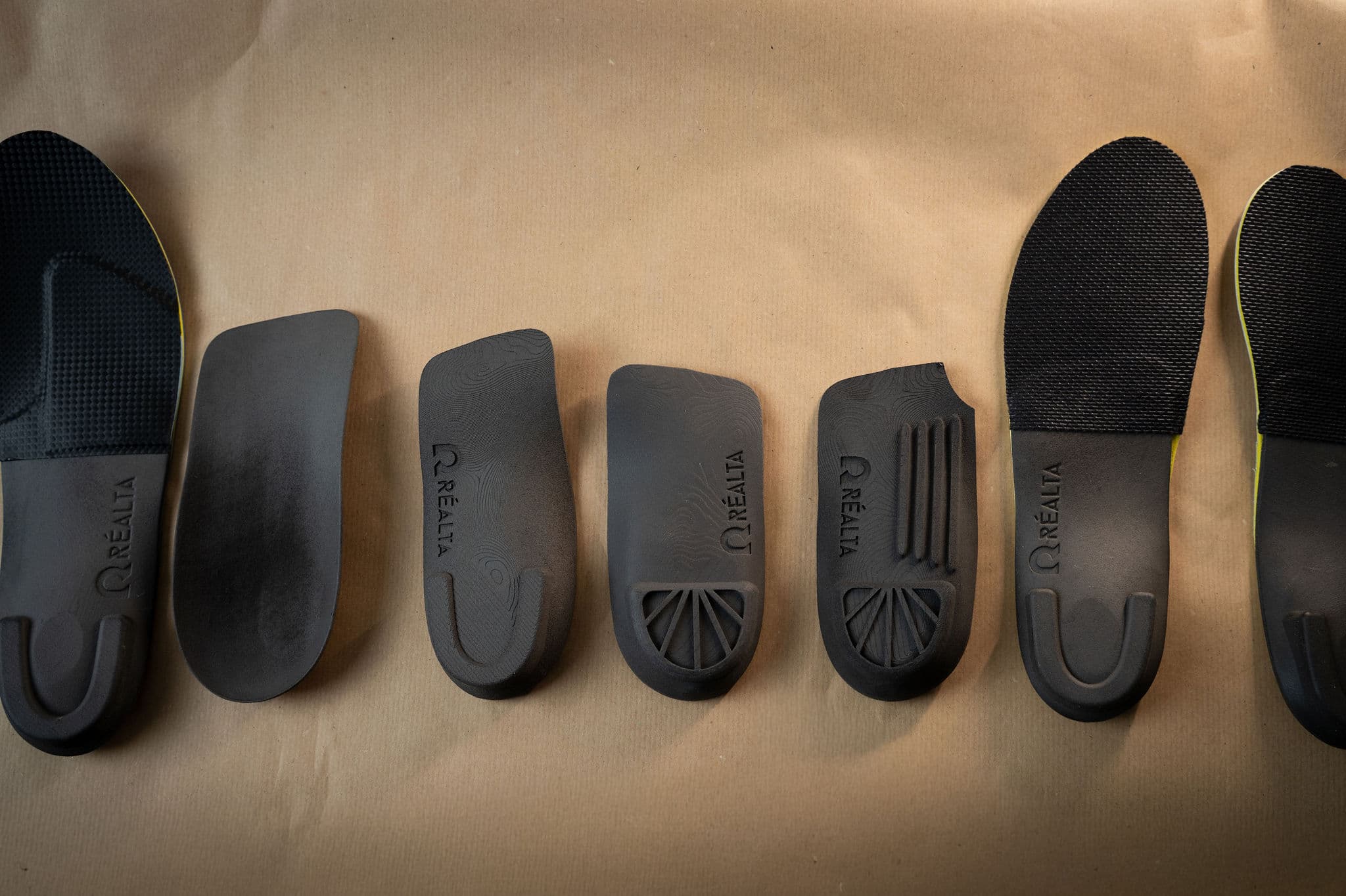 Full range of Réalta Labs orthotic products lined up on paper